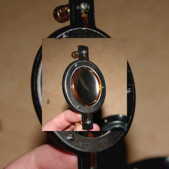 Close-up of a raw speaker driver voice coil and diaphragm